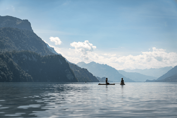 A scenic twilight view of Lake Brienz surrounded by the towering Swiss Alps in Interlaken, Canton of Bern, Switzerland.